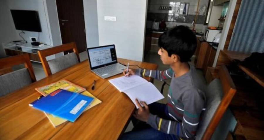 Student attending an online English class on laptop — building language skills needed for Ivy League applications from India