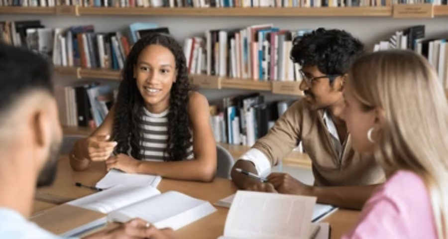 Diverse group of students walking confidently on a university campus — Indian students beginning their first semester at an Ivy League university