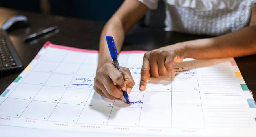 Person planning a roadmap and schedule for long-term academic goals