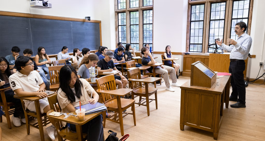 Students engaged in a seminar style classroom discussion — the kind of intimate academic experience that defines undergraduate education at Yale and Princeton
